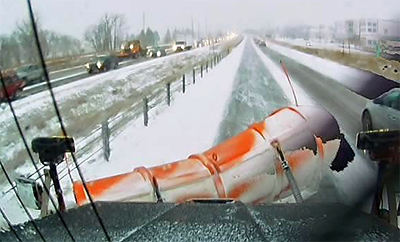 Photo: Out the front window of a snowplow in Anoka.